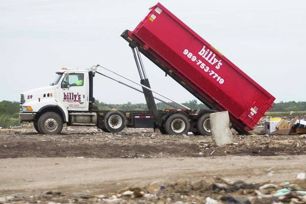 A Billy's waste removal truck dumps refuse at the Midland City Landfill on Wednesday. (Katy Kildee/kkildee@mdn.net)