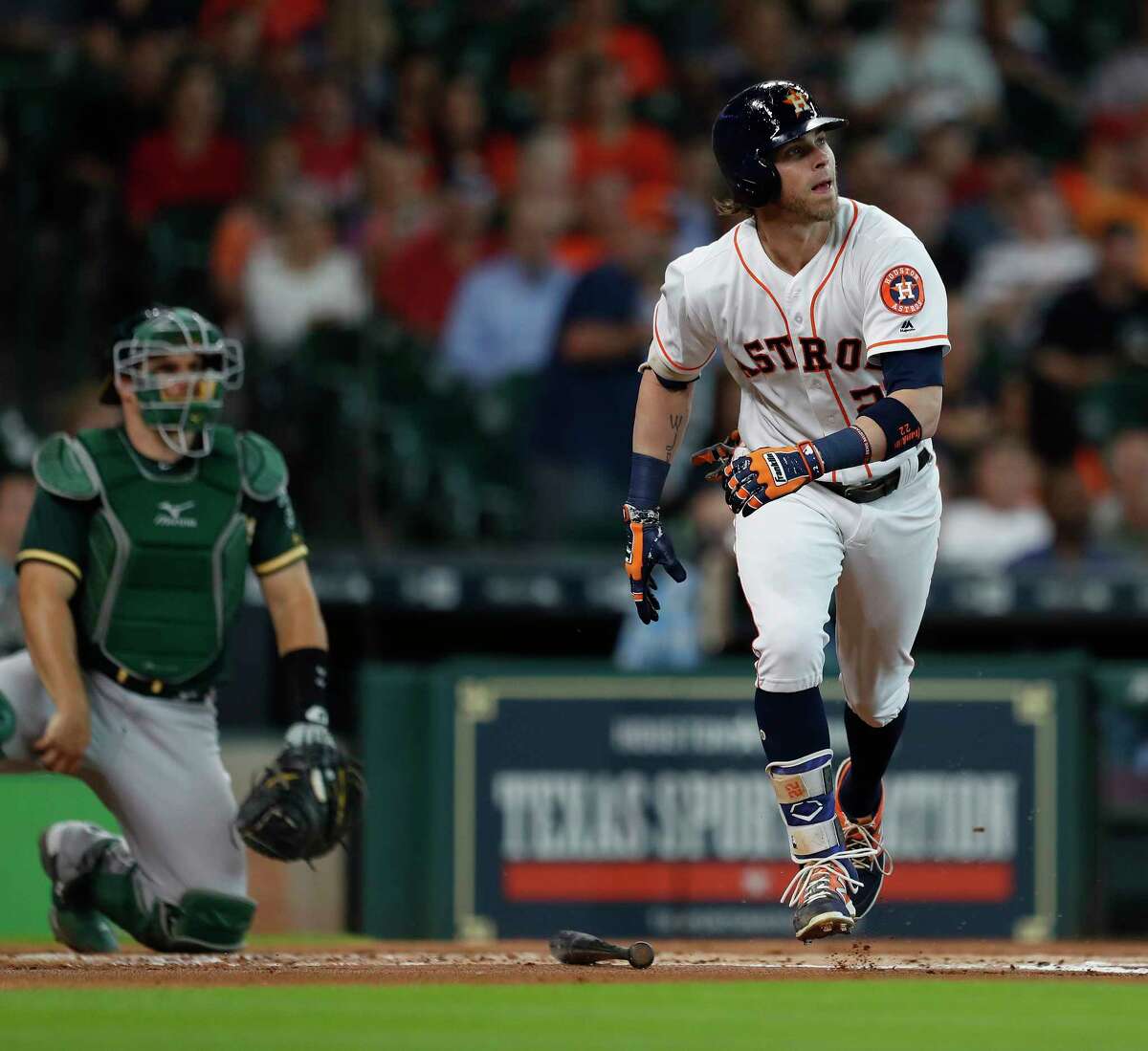 Houston Astros Josh Reddick (22) watches his ball head to the right field wall as Oakland Athletics right fielder Matt Joyce jumped up to haul it in during the first inning of an MLB baseball game at Minute Maid Park, Thursday, June, 29, 2017.