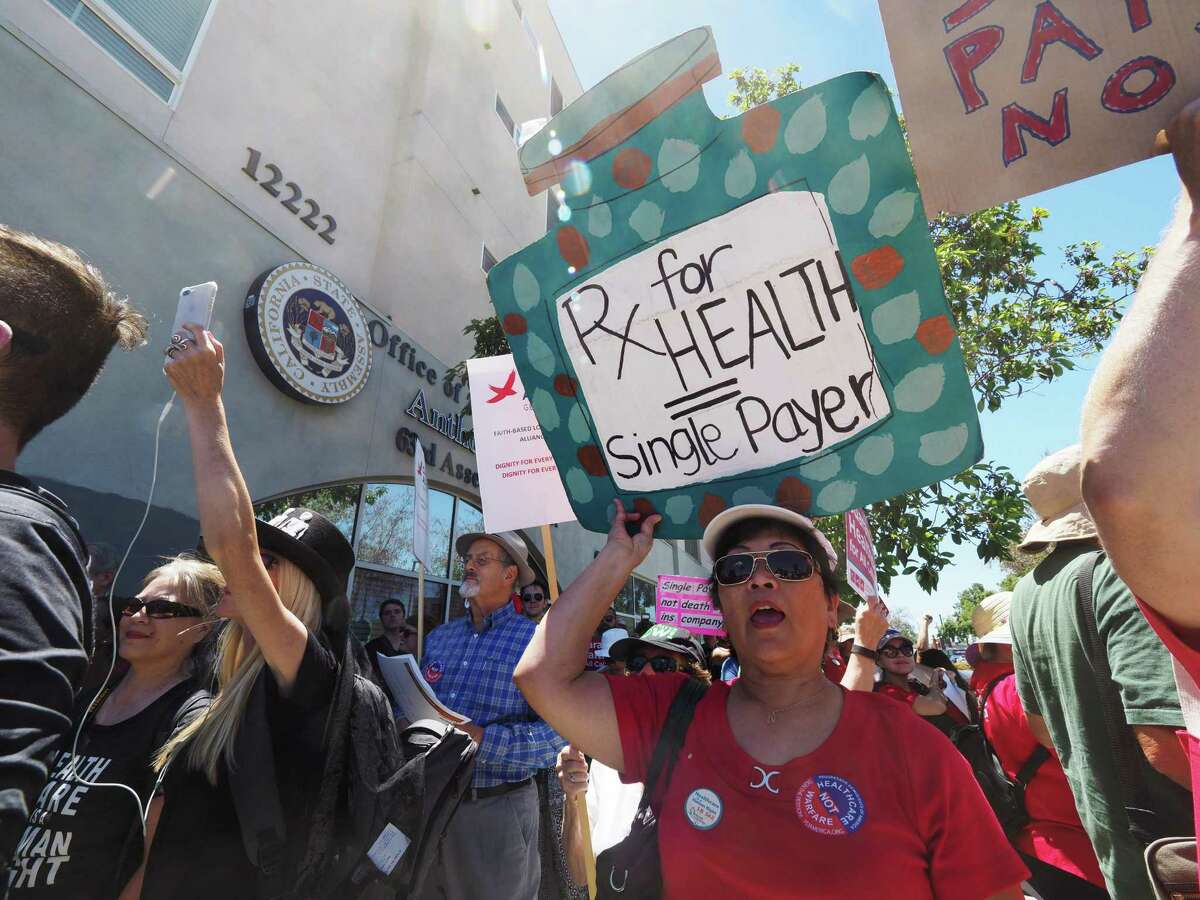 People rally in favor of single-payer healthcare for all Californians in South Gate, California as U.S. Senate leadership postponed a vote on its health care measure. The bill was a tough sell because it was cast as mean, but market-based health reform is possible.