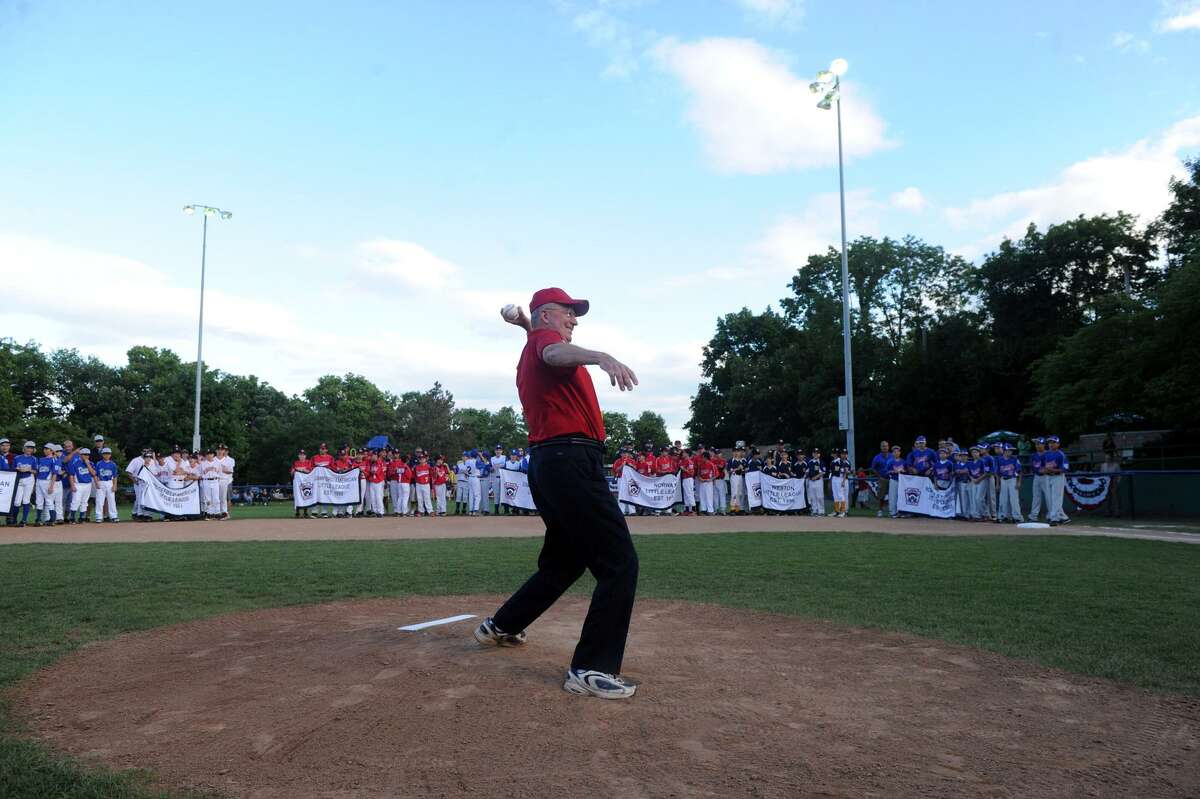 Joe Deleo throws the first ceremonial pitch during the Little League Opening Ceremonies at Springdale's Drotor Field in Stamford, Conn., June 26, 2012. Deleo is the manager for the Clairol team, he has been coaching in Springdale for 48 years.