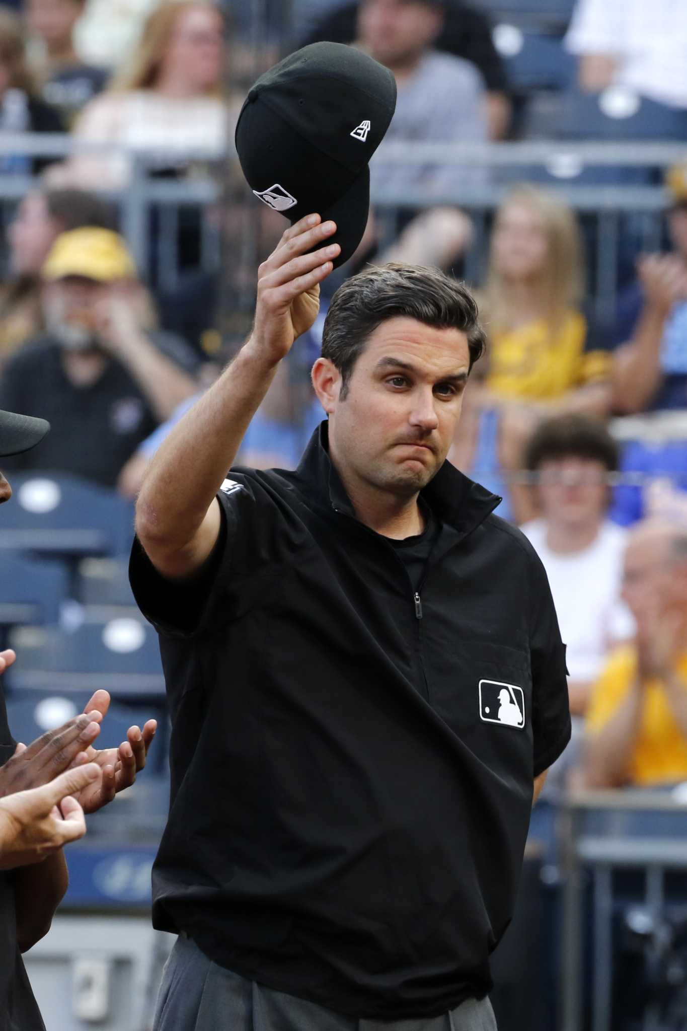 MLB umpire John Tumpane rescues woman on bridge