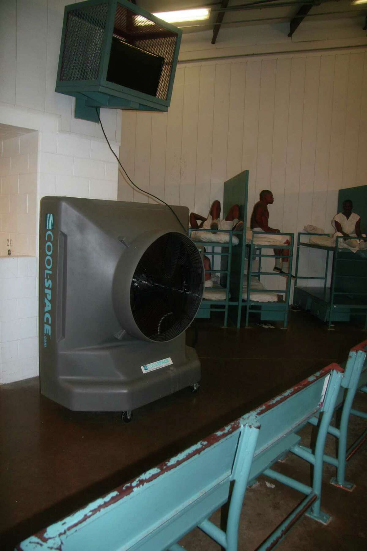 The Texas Department of Criminal Justice says it's taken steps to protect inmates from extreme heat — such as these large fans installed at the Holliday Unit near Huntsville in 2014 — but lawsuits allege those measures, which also include showers and cold water, are inadequate in facilities that lack air conditioning.