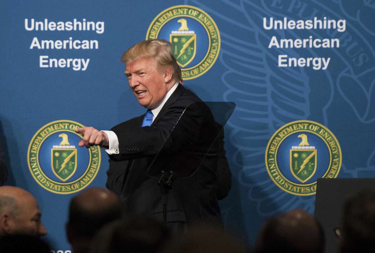 U.S. President Donald Trump points while leaving the stage after speaking during the Unleashing American Energy event at the Department of Energy in Washington, D.C., U.S., on Thursday, June 29, 2017. TrumpÂ said he is lifting an Obama-eraÂ policy that curtailed the financing of coal-fired power plants overseas, as he seeks to reorient the U.S. government away from fighting climate change and toward American "energy dominance." Photographer: Kevin Dietsch/Pool via Bloomberg