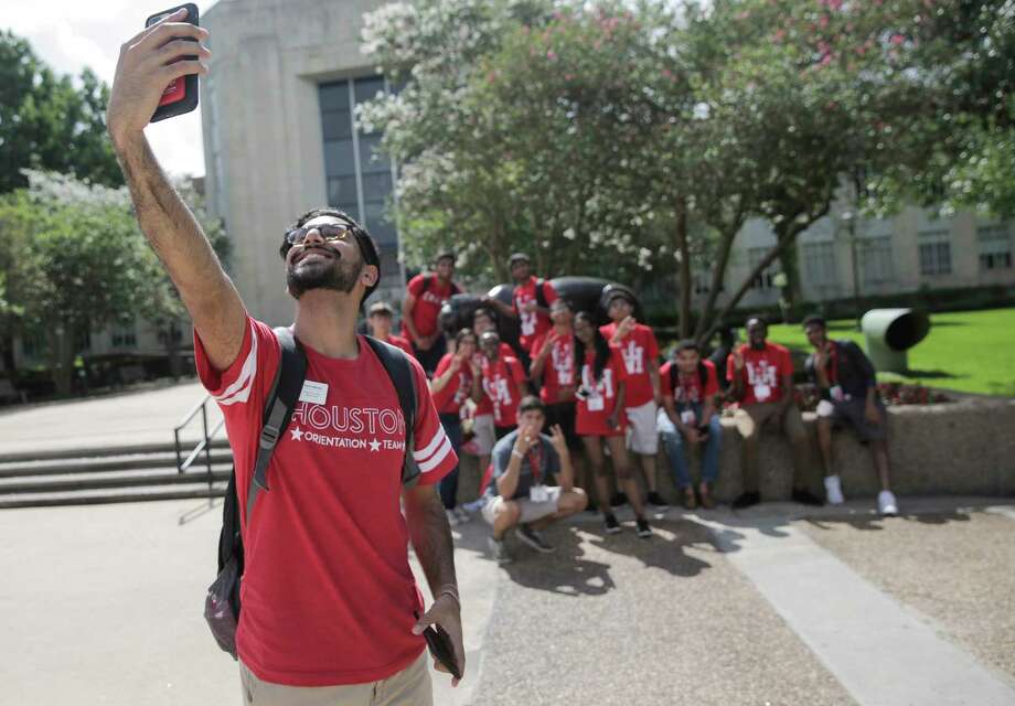 Karim Motani, a junior at UH, takes a group photo of University of Houston incoming students participating in an orientation on campus on  Tuesday, June 13, 2017, in Houston. Photo: Elizabeth Conley, Houston Chronicle / © 2017 Houston Chronicle