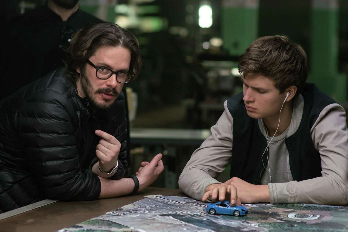 Writer-director Edgar Wright, left, and actor Ansel Elgort on the set of the new car chase-musical "Baby Driver".