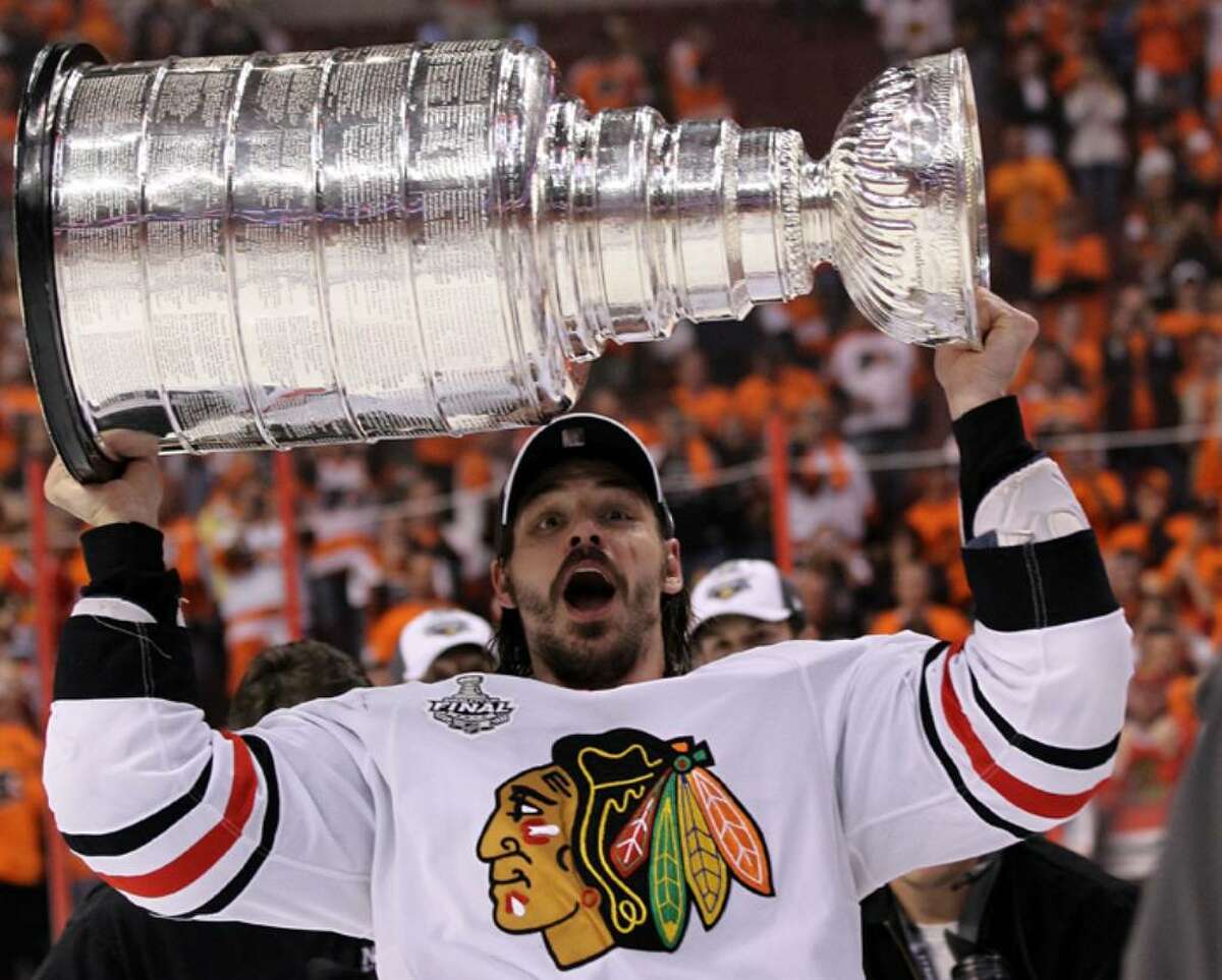 PHILADELPHIA - JUNE 09: Brent Sopel #5 of the Chicago Blackhawks hoists the Stanley Cup after the Blackhawks defeated the Philadelphia Flyers 4-3 in overtime to win the Stanley Cup in Game Six of the 2010 NHL Stanley Cup Final at the Wachovia Center on June 9, 2010 in Philadelphia, Pennsylvania. (Photo by Bruce Bennett/Getty Images) *** Local Caption *** Brent Sopel