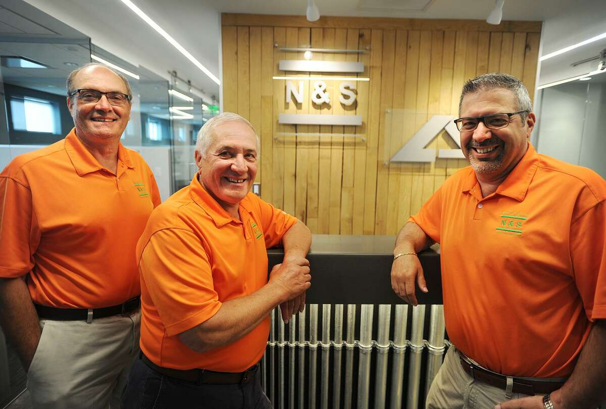 From left; Brothers Tony, Mike, and Phil Nizzardo, Jr. celebrate fifty years in business at N & S Electric, the business started by their father, Phil Nizzardo, Sr., at 120 Allen Street in Stratford, Conn. on Thursday, June 29, 2017.