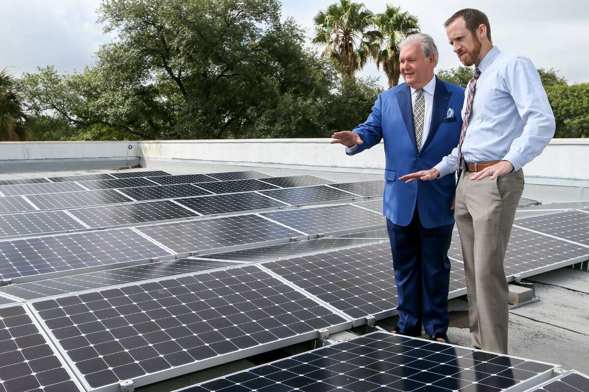 Dick Tips (left), chairman and CEO of Mission Park Funeral Chapels & Cemeteries, looks over an installation of solar panels on the rooftop of Mission Park North, 3401 Cherry Ridge, with Kyle Frazier, director of sales with Freedom Solar, on Thursday, June 29, 2017. The funeral home used a CPS rebate and a federal tax credit program to install a solar panels in May of this year at eight of its locations for a total cost of more than $1 million.