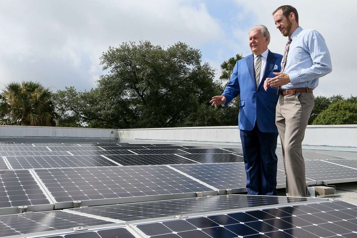 Dick Tips (left), chairman and CEO of Mission Park Funeral Chapels & Cemeteries, looks over an installation of solar panels on the rooftop of Mission Park North, 3401 Cherry Ridge, with Kyle Frazier, director of sales with Freedom Solar, on Thursday, June 29, 2017. Mission Park now has solar panels on eight of its locations.