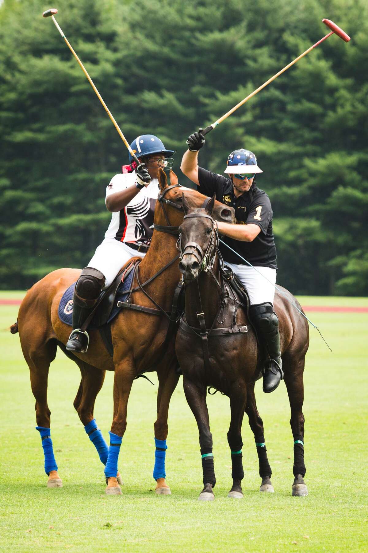 Shariah Harris goes up against Joseph Manheim in the 2017 Silver Cup Polo Match at the Greenwich Polo Club in Greenwich, Conn. on Friday, June 30, 2017. 19-year-old Harris, an inner-city teen from South Philadelphia, made history Friday as the first African American female to play high goal polo in the United States.