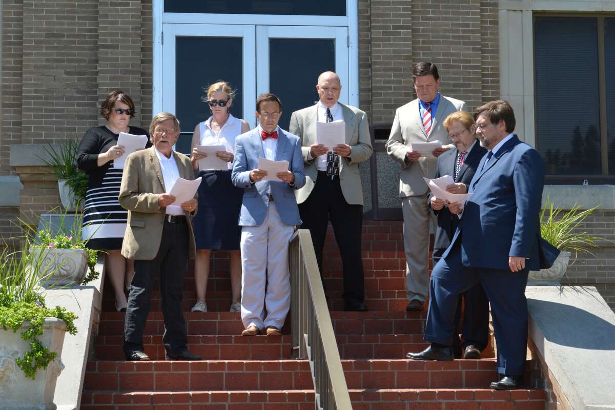 Members of Plainview’s legal community recited the American Declaration of Independence from the Hale County Courthouse steps at noon Friday, in honor of the nation’s 241st birthday. Coordinated by the Hale County Bar Association, it was the group’s fourth consecutive year to recreate the watershed event of first public reading of the Declaration of Independence in Philadelphia, Pennsylvania, in 1776. Similar readings are scheduled throughout Texas over the holiday weekend. Those taking turns reciting portions of the Declaration on Friday were Rudd Owen, Kelly Hollingsworth, Don Snodgrass, Katherine Goebel, Tina Davis-Rincones, Jim Tirey, Troy Bollenger and County Judge Bill Coleman.