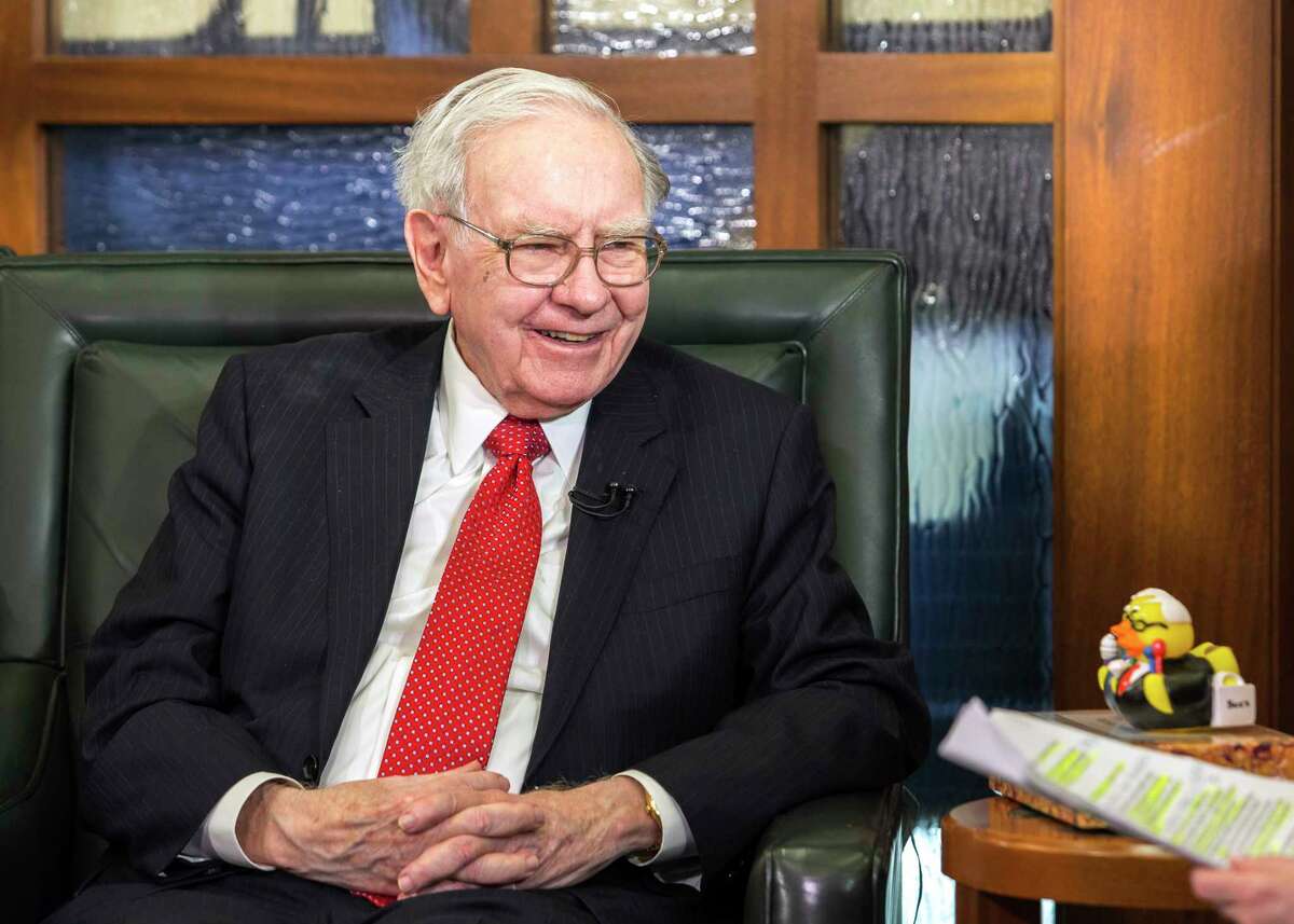 FILE - In this May 2, 2016, file photo, Berkshire Hathaway Chairman and CEO Warren Buffett is interviewed in Omaha, Neb. Buffett's Berkshire Hathaway is buying 700 million shares in Bank of America, making Buffett the largest shareholder in two of the nation's largest banks. (AP Photo/John Peterson, File)