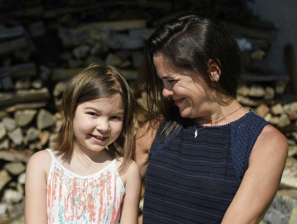 Cancer patient Lynn Willow Gulli, 7, poses with her mother Cindy Gulli at a friend's home in Greenwich, Conn. Wednesday, June 28, 2017. Gulli was diagnosed with Acute Lymphoblastic Leukemia in April and has entered a two- to three-year treatment plan at Yale New Haven Children?’s Hospital, during which time her immune system will be severely compromised. The mission of The Willow Project is to raise essential funds to absorb the Gulli family's financial burden while Lynn battles her disease.