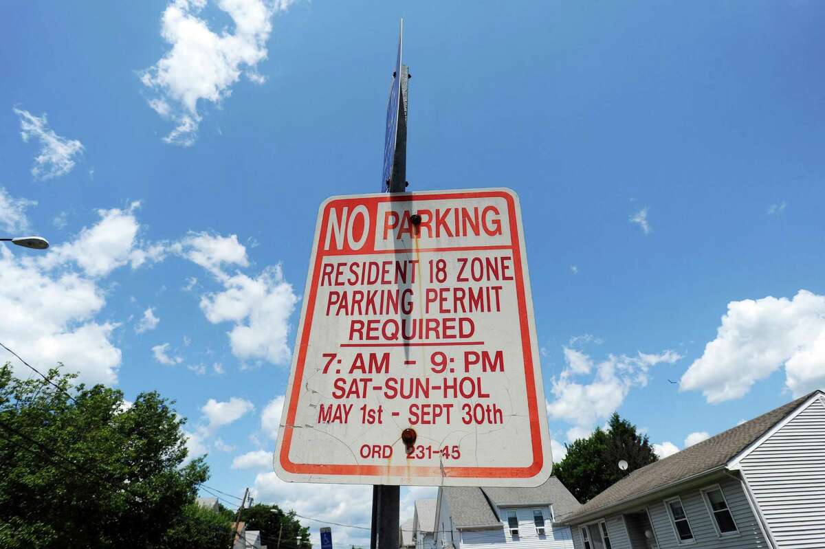 A permit parking only sign sits idly on Dean Street in the Cove neighborhood of Stamford.