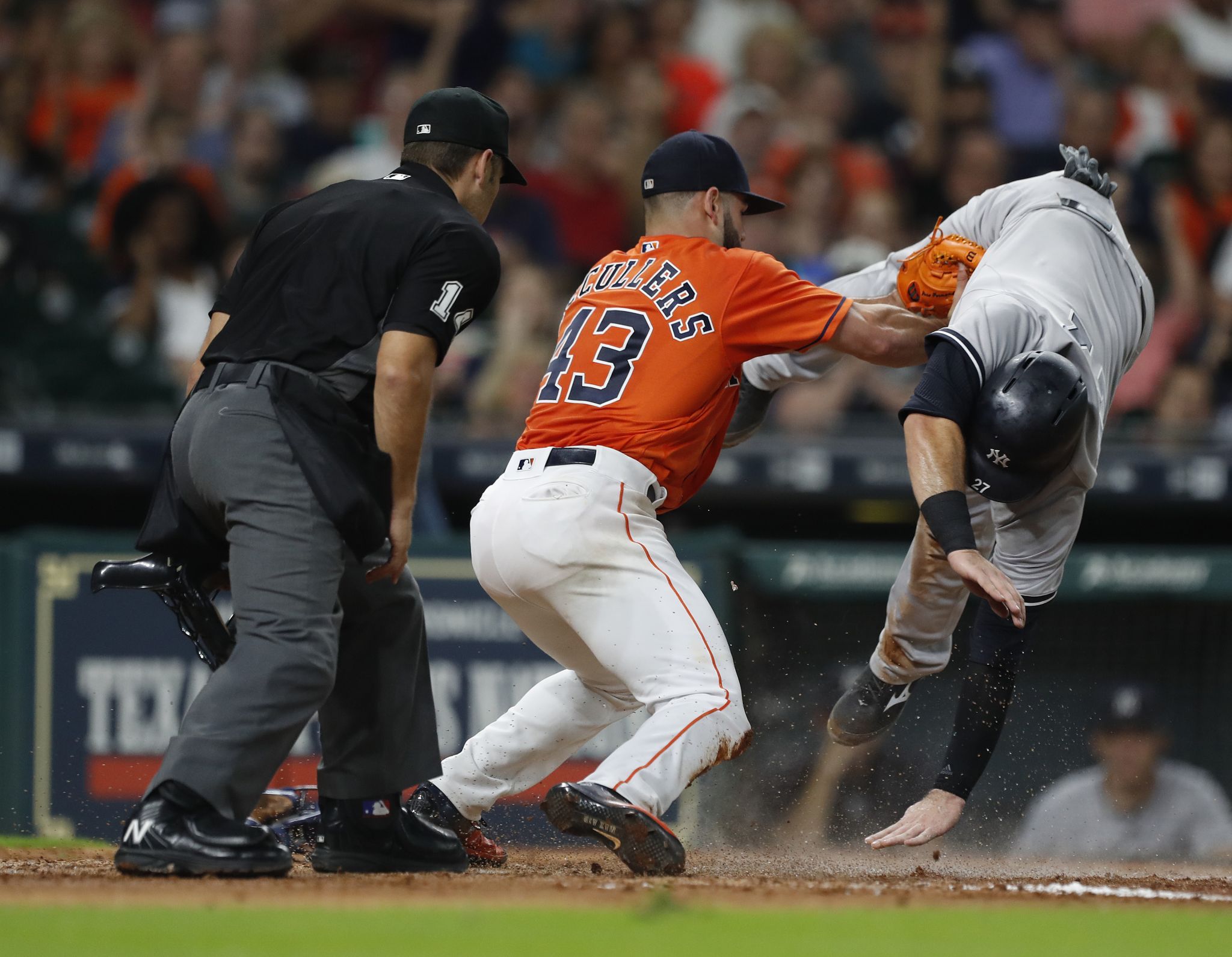 Houston Astros' Carlos Correa (1) low-fives Alex Bregman after Bregman  scored his second run of a baseball game on a sacrifice fly by Yordan  Alvarez during the sixth inning against the Seattle