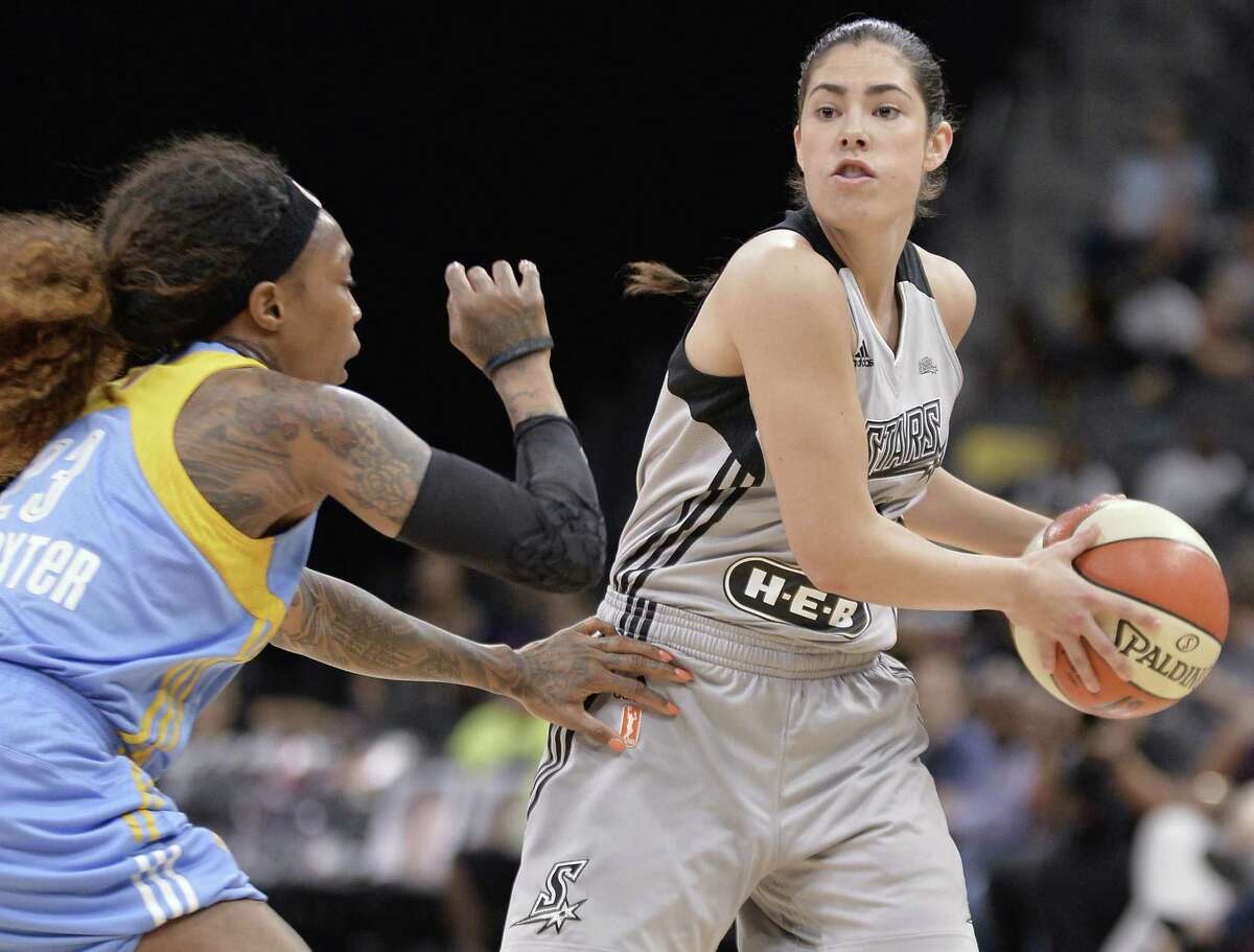 Stars’ Kelsey Plum tries to pass around the Chicago Sky’s Cappie Pondexter during the first half on June 30, 2017, in San Antonio.