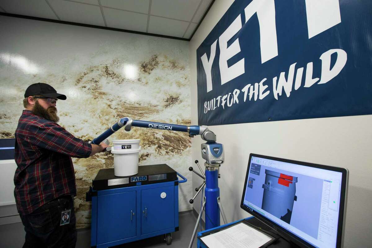Zac Alsobrooks uses a LASER guided coordinate measuring machine to scan a product for quality control at the YETI Innovation Center on Thursday, June 29, 2017, in Austin. YETI products, from prototype to final product, are tested in multiple ways. ( Brett Coomer / Houston Chronicle )