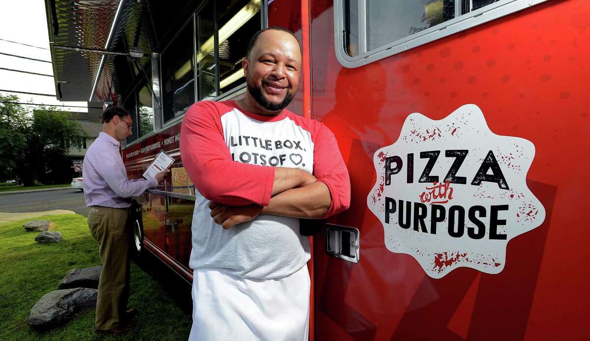 James Gibson who is operating a pizza truck under the auspices of Little Box Pizza, is photograph with his truck at the First Presbyterian Church's on Thursday, June 29, 2017 in Stamford, Connecticut.