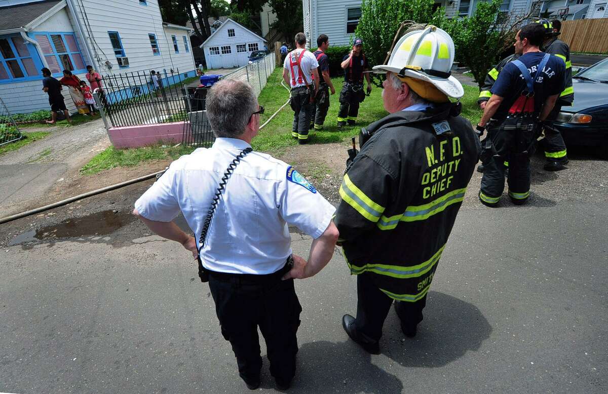 The Norwalk Fire Department responds to a small basement fire at 17 Slocum Street Saturday, July 1, 2017, in Norwalk, Conn. No one was hurt in the blaze.