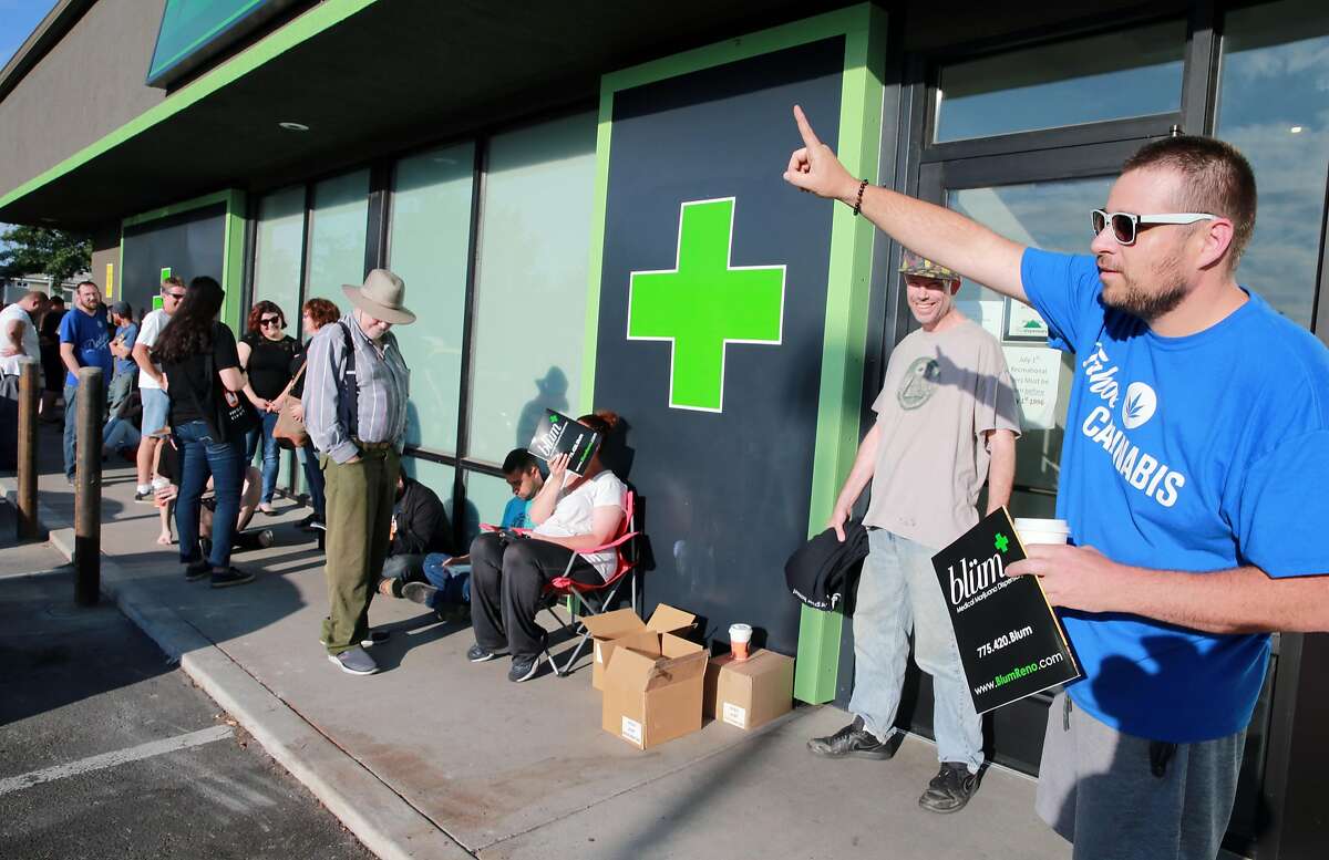 Todd Weatherhead from Reno Nevada proudly tells all new arrivals at The Dispensary, that he is first in line, to purchase recreational marijuana. Four northern Nevada dispensaries started selling recreational marijuana to the public. Saturday, July 01, 2017. (Photo by Lance Iversen)