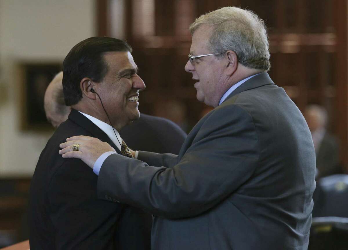 Texas Senator Paul Bettencourt, R-Houston, right, is congratulated by Sen. Eddie Lucio Lucio, Jr., D-Brownsville, after his property tax bill passes the senate, Tuesday, March 21, 2017. The bill, SB2, puts further restrictions on city and county property tax revenues and was approved by the senate. The bill will move on to the House of Representatives.
