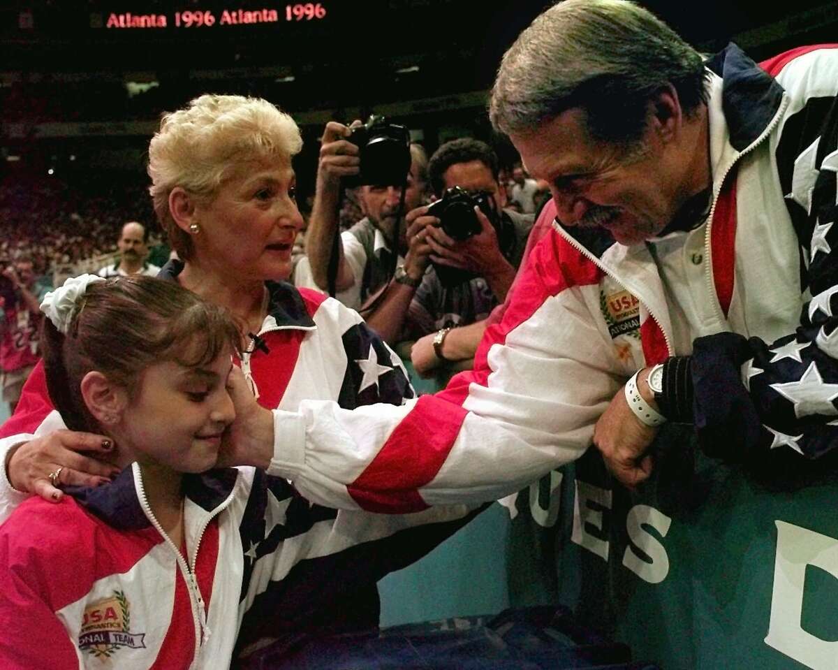 Dominique Moceanu, left, has been critical of the way Martha Karolyi, center, and Bela Karolyi, right, ran the selection process for the U.S. women's gymnastics teams over the years.