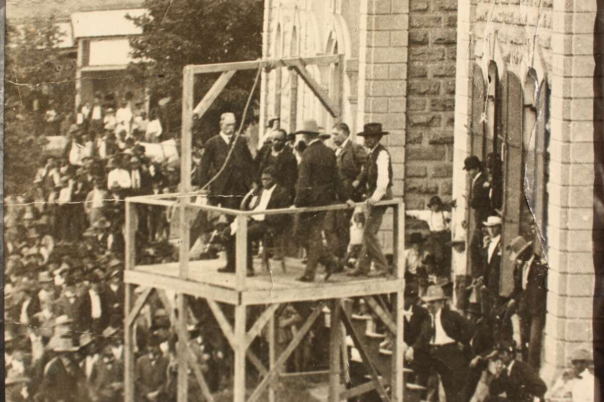 Henry Johnson, seated over the trapdoor moments before his execution in Kaufman County, 1903.