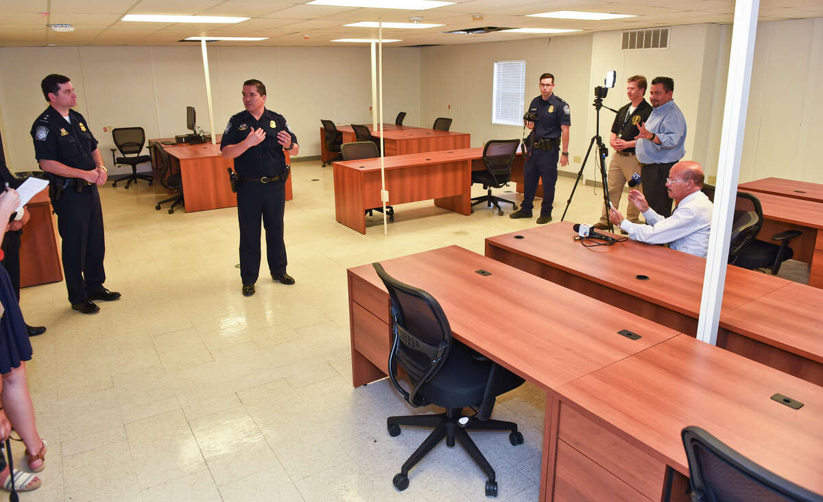Customs and Border Protection Deputy Port Director Alberto Flores shows the office spaces for bridge workers during a media tour of the temporary office buildings at the World Trade Bridge on Friday, June 30, 2017; 40 days after a storm damaged the main building.