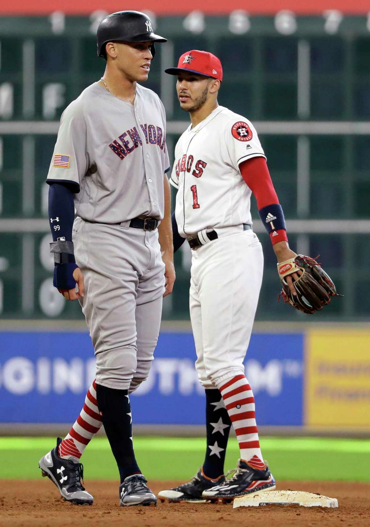 Houston Astros shortstop Carlos Correa (1) talks with New York Yankees' Aaron Judge during the eighth inning of a baseball game Sunday, July 2, 2017, in Houston. (AP Photo/David J. Phillip)