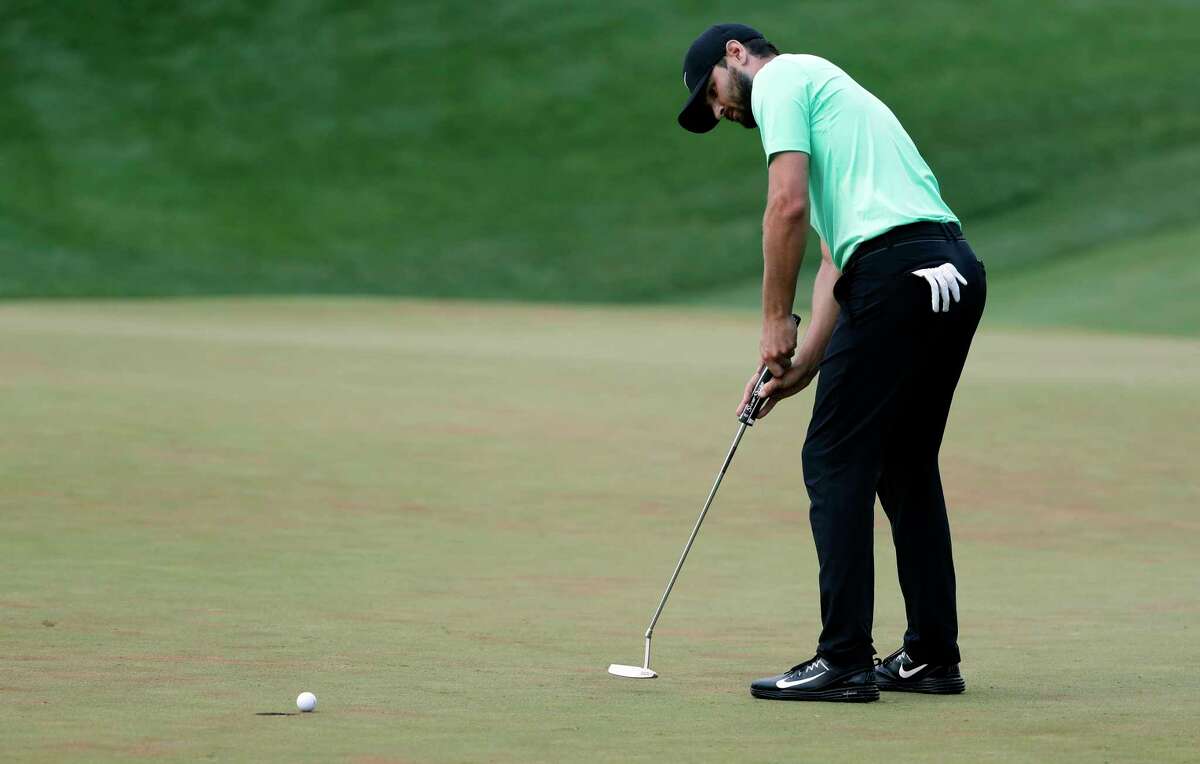 Kyle Stanley sinks the winning putt on the 18th green of the playoff, during the Quicken Loans National golf tournament, Sunday, July 2, 2017, in Potomac, Md. (AP Photo/Alex Brandon)
