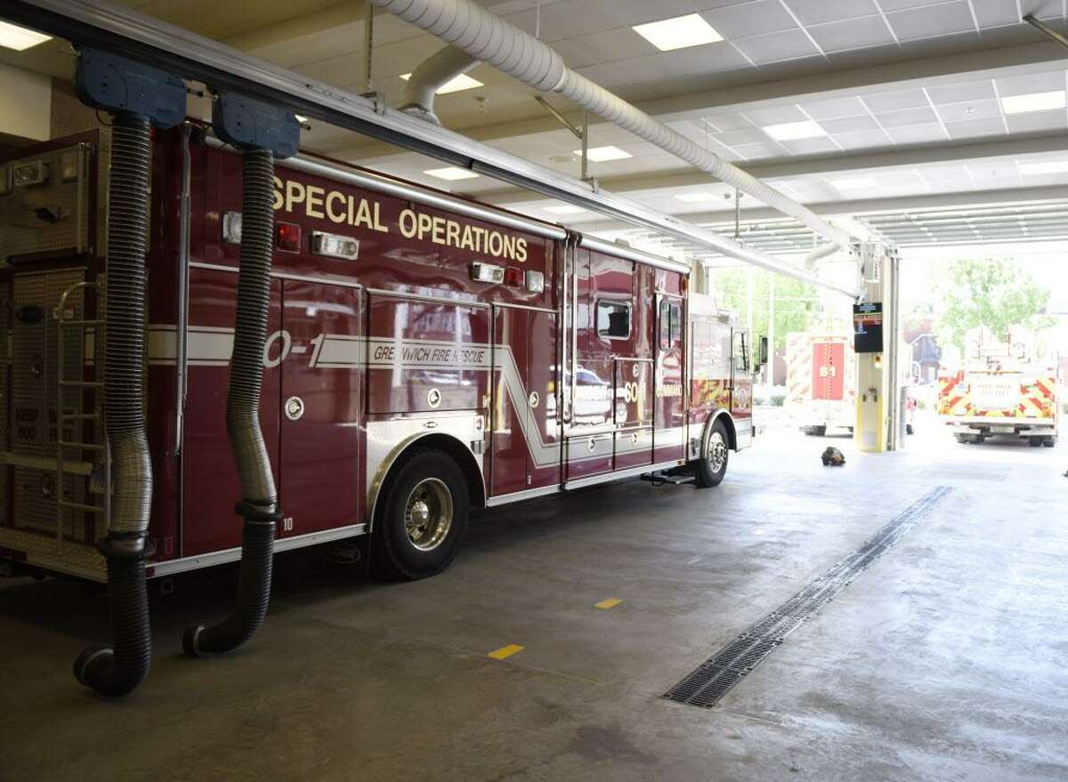 FILE — A fire engine sits inside the main bay at the Central Fire Station after its official opening in Greenwich, Conn. Wednesday, May 24, 2017. 