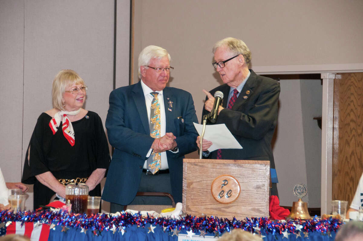 J.B. Roberts (right) installs Dr. Charles Starnes as district governor of Rotary International District 5730 on Friday at the Plainview Convention Center. Looking on is Starnes’s wife, Susie. Among those participating in the ceremonies are Immediate Past District Governor Susan Brints, District Governor Elect Dan Linebarger and District Governor Nominee Steven Long.