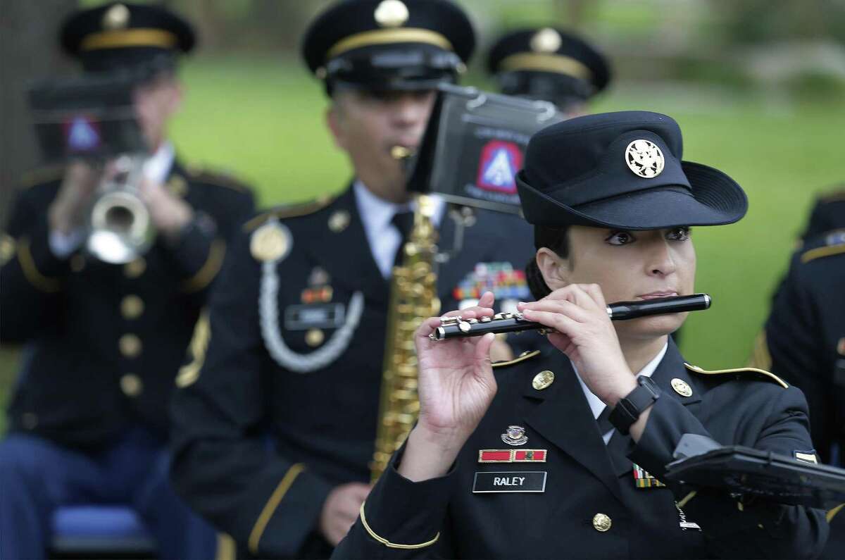 Sgt. Leanne Raley performs with the 323rd Army Band during a retirement ceremony at Fort Sam Houston on Thursday, June 29, 2017. In San Antonio, a U.S. Army town going back to statehood, one of its grand traditions for more than a century has been singing patriotic songs at various events to the strains of a band from Fort Sam Houston. That era is coming to an end. The Army is breaking up the 323rd Army Band, called Fort Sams Own, ending a run that has seen musicians from the post serenading everything from command change ceremonies and funerals for heroic soldiers to downtown parades.(Kin Man Hui/San Antonio Express-News)