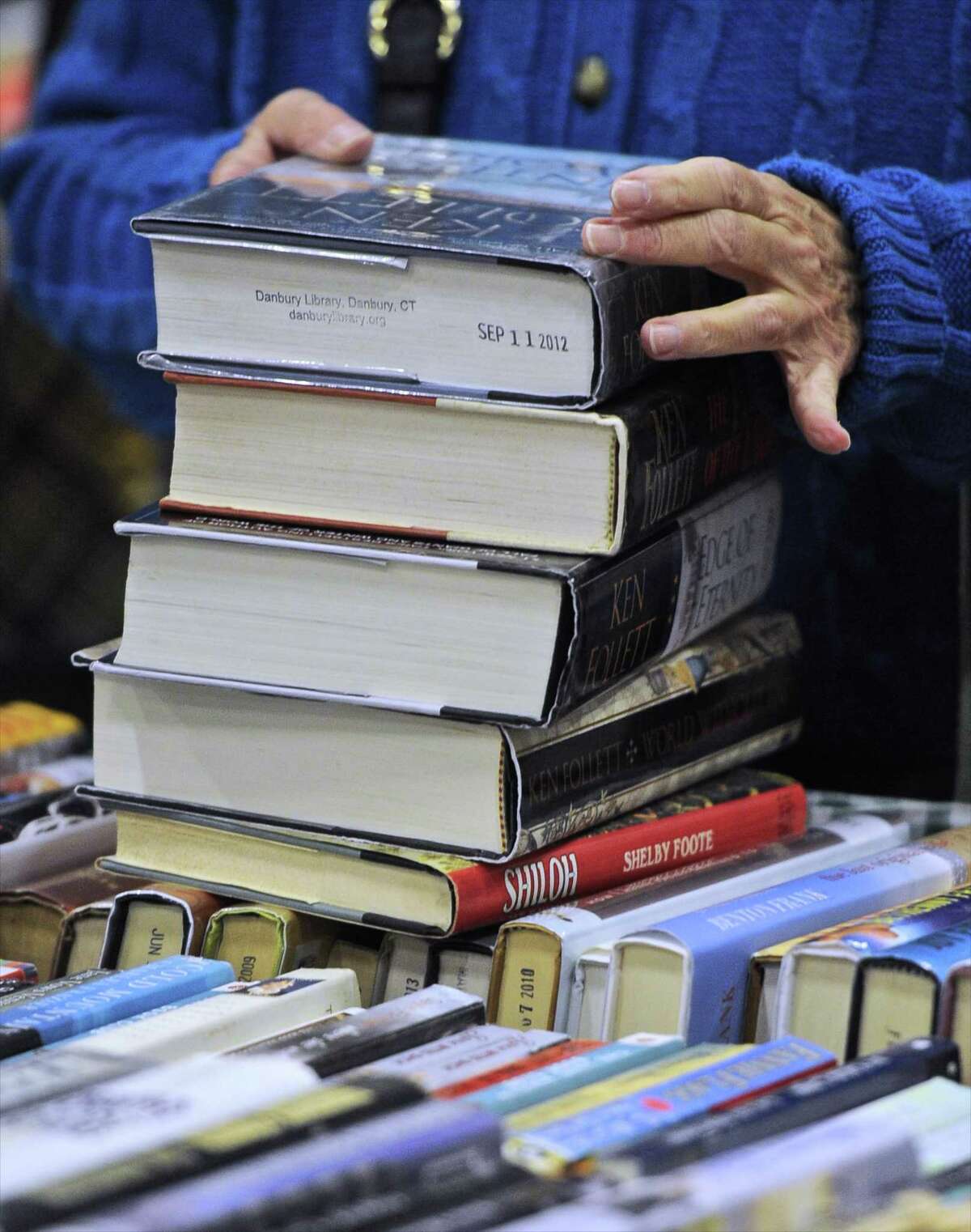 A stack of books at the Friends of Danbury Library annual book sale, held at the Danbury PAL building on Saturday, October 8, 2016, in Danbury, Conn.