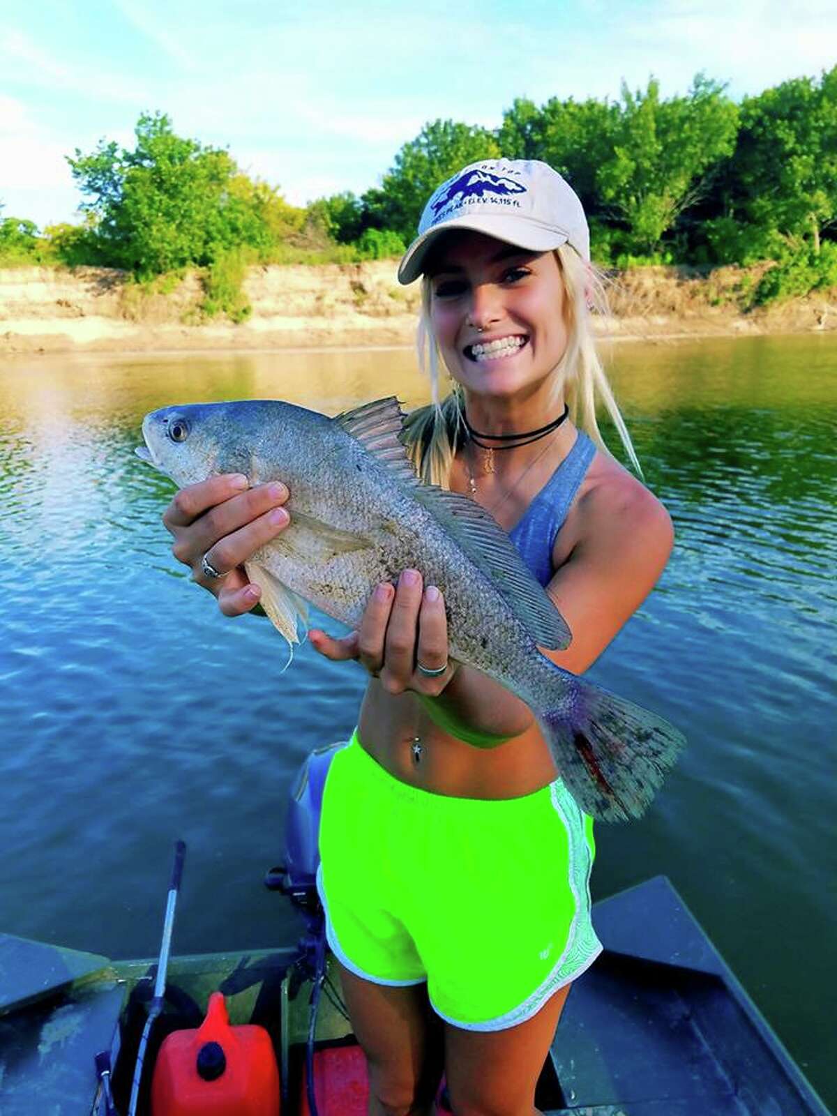 Video Texas woman baits hook after biting the head off of a small shad