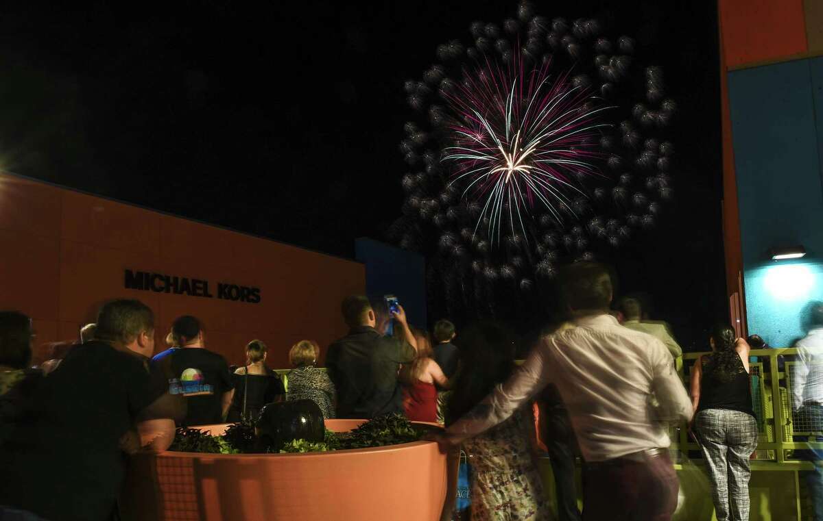 Shoppers watch a fireworks display from the walk-way at The Outlet Shoppes of Laredo on Wednesday, April 5, 2017 as part of a celebration for the official opening of The Outlet Shoppes of Laredo.