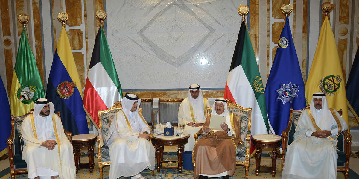 In this photograph released by the state-run Kuwait News Agency, KuwaitÂ?’s ruler Sheikh Sabah Al Sabah, center right, looks at a letter from QatarÂ?’s ruler given to him by Qatari Foreign Minister Sheikh Mohammed bin Abdulrahman Al Thani, center left, Monday, July 3, 2017. The Arab nations earlier on Monday extended a deadline for Qatar to meet their demands to end the dispute by 48 hours. (KUNA via AP)