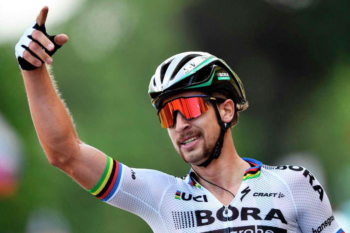 Slovakia's Peter Sagan celebrates as he crosses the finish line at the end of the 212,5 km third stage of the 104th edition of the Tour de France cycling race on July 3, 2017 between Verviers, Belgium and Longwy, France. / AFP PHOTO / Jeff PACHOUDJEFF PACHOUD/AFP/Getty Images
