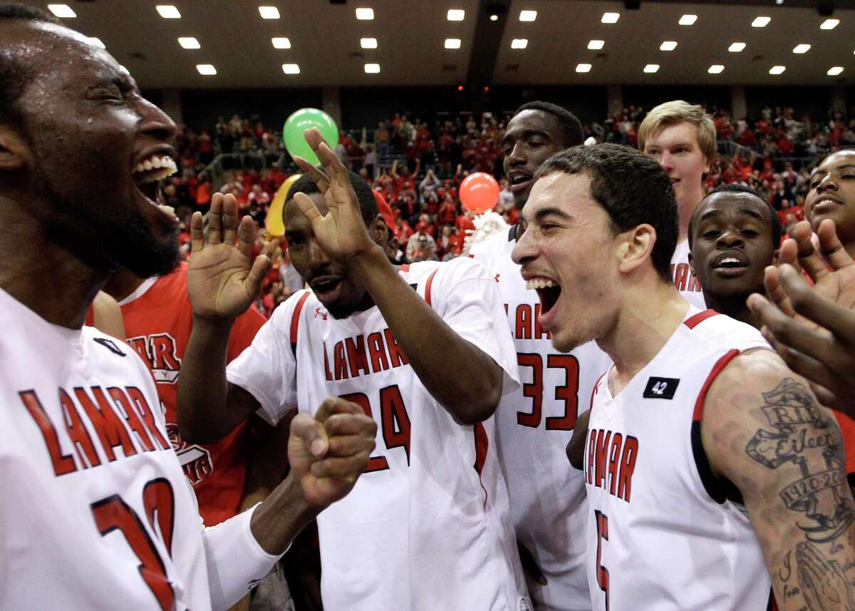 Lamar's Mike James (5), Vincenzo Nelson (24) and Brandon Davis (20) celebrate with teammates after winning the Southland Conference tournament championship basketball game Saturday, March 10, 2012, in Katy, Texas. Lamar beat McNeese State 70-49. (AP Photo/David J. Phillip)