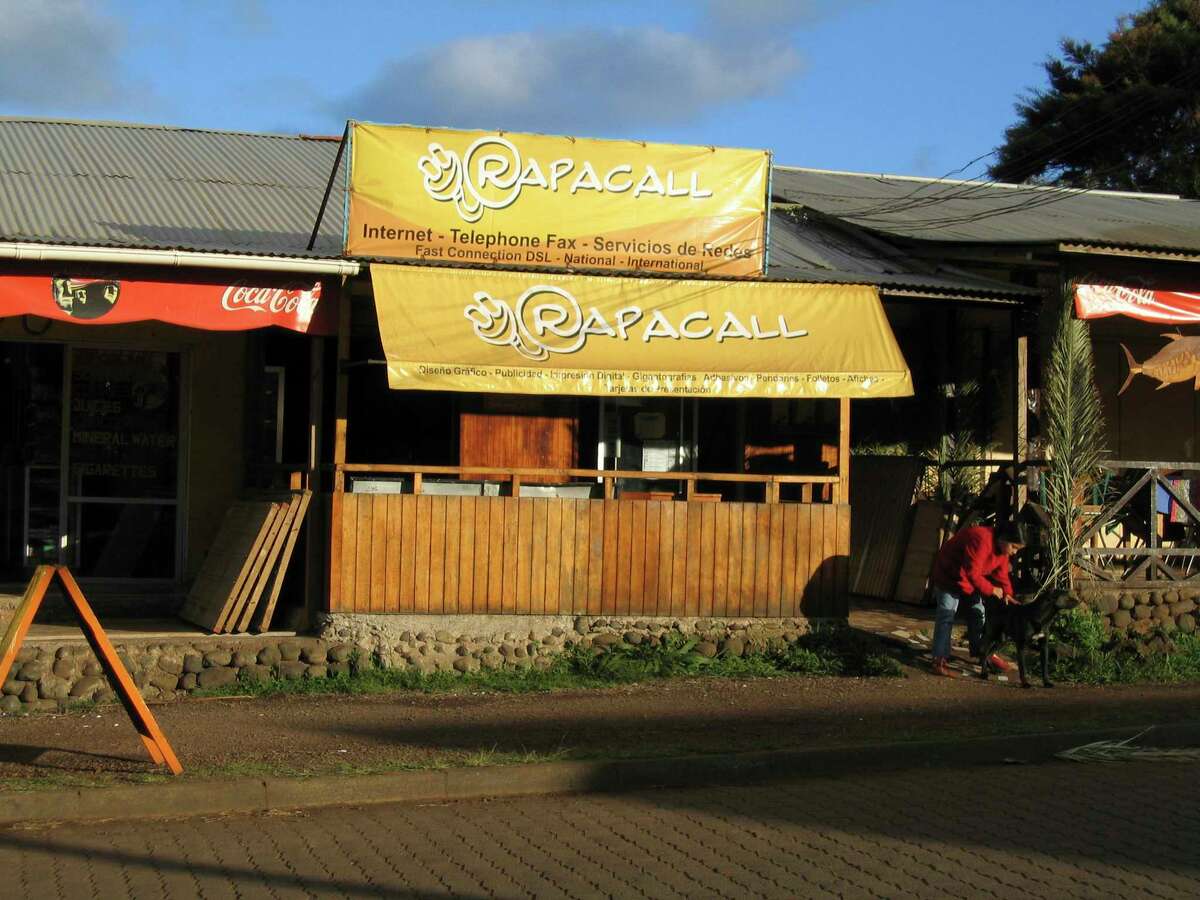 This photo provided by small business owner Mike Scanlin shows an internet cafe in the city of Hanga Roa on Easter Island. This is the only internet cafe on the island and is where Scanlin responded to all of his emails once a day. As far as Scanlin's customers knew, he was home in California, where he lived at the time, answering emails at strange hours. (Mike Scanlin via AP)