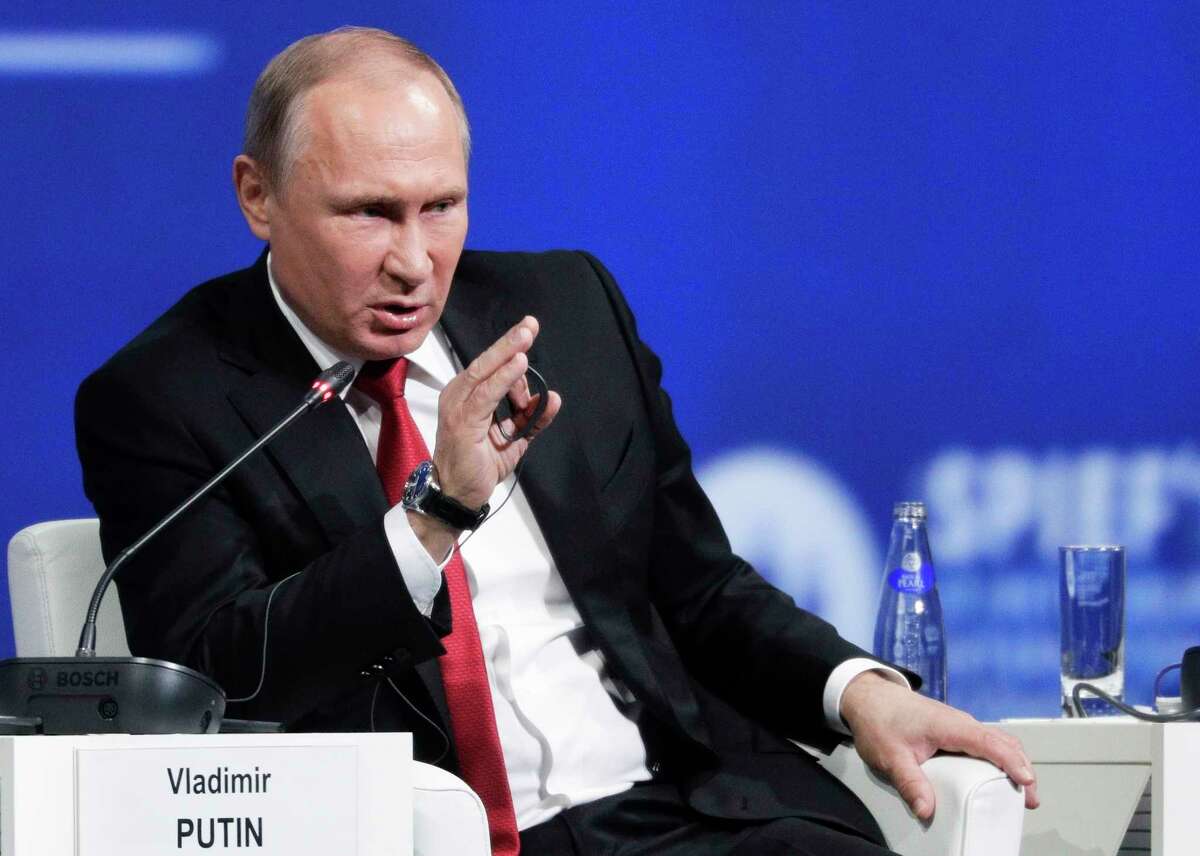 FILE - In this June 2, 2017 file photo, Russian President Vladimir Putin speaks in St.Petersburg, Russia. President Donald TrumpÂ?’s first face-to-face meeting with Russian President Vladimir Putin this week will be brimming with global intrigue, but the White House says thereÂ?’s Â?“no specific agenda.Â?” So in the absence of a set topic list, what are two of the worldÂ?’s most famously unpredictable leaders to discuss? (AP Photo/Dmitry Lovetsky, File)
