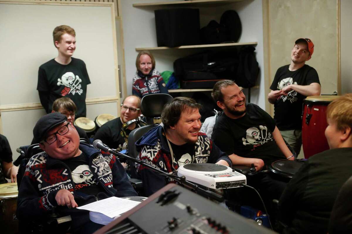 In this picture taken on Tuesday, May 2, 2017, members of the Tap Tap orchestra rehearse at their studio in Prague, Czech Republic. What was created some 18 years ago in efforts to give kids some extracurricular activity at a renowned school for the disabled in Prague has become a major music act that has drawn millions of listeners and fans, first at home and gradually abroad. (AP Photo/Petr David Josek)