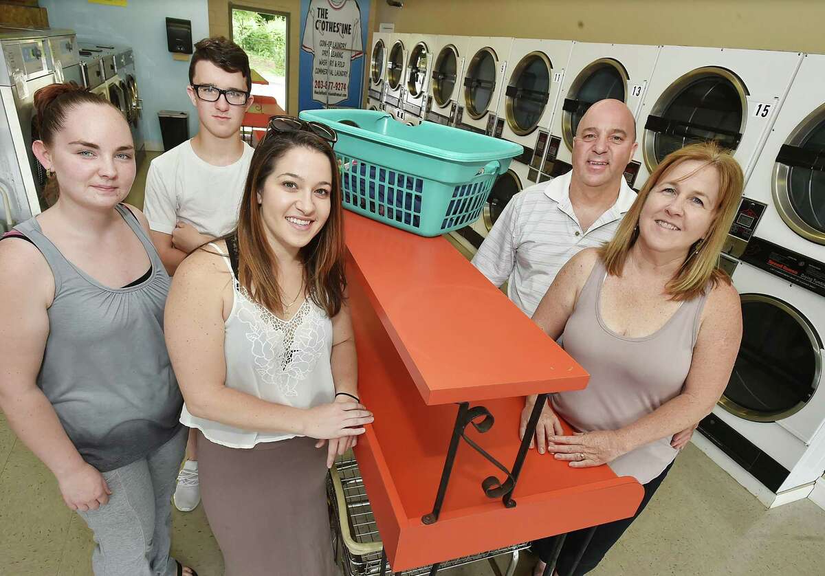 Milford laundromat hit hard by storms reopens to fanfare a few blocks