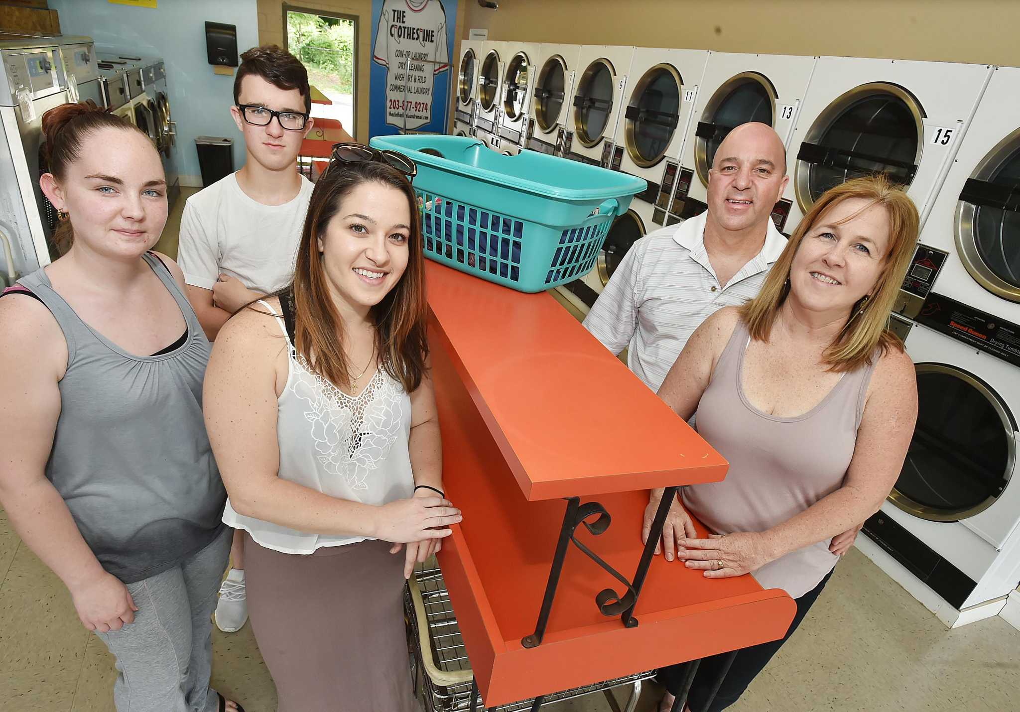 Milford laundromat hit hard by storms reopens to fanfare a few blocks 