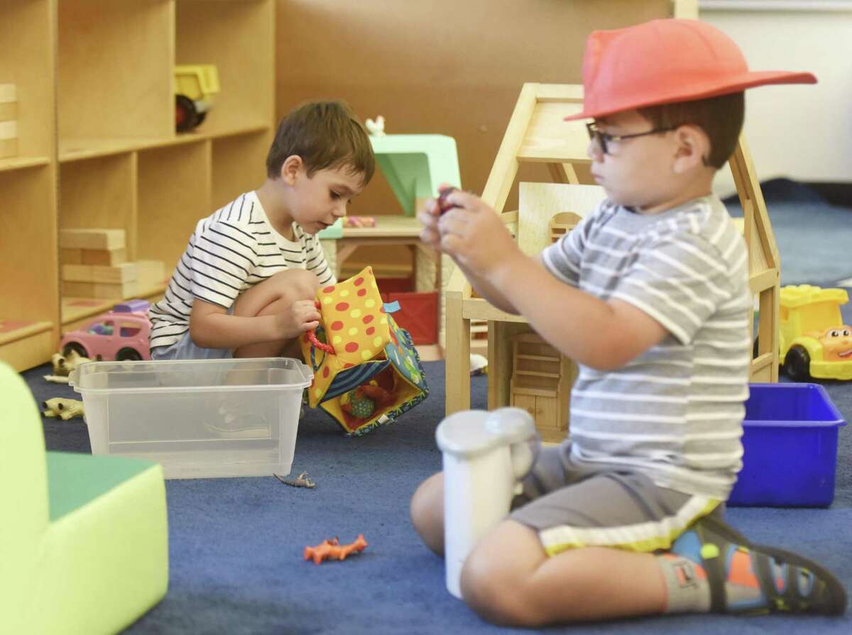 Pre-K students Emerson Matsko, left, and Amerigo DiFilippo play on the first day of pre-K summer school at North Street School in Greenwich, Conn. Wednesday, July 5, 2017.