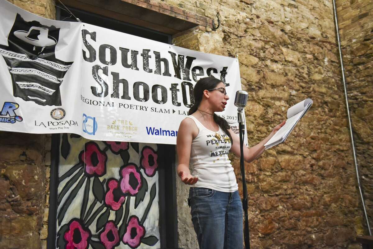 Julia Orduña reads the rules of the Border Slam on Thursday, June 22, 2017 as participants prepare to read their poems at Gallery 201.