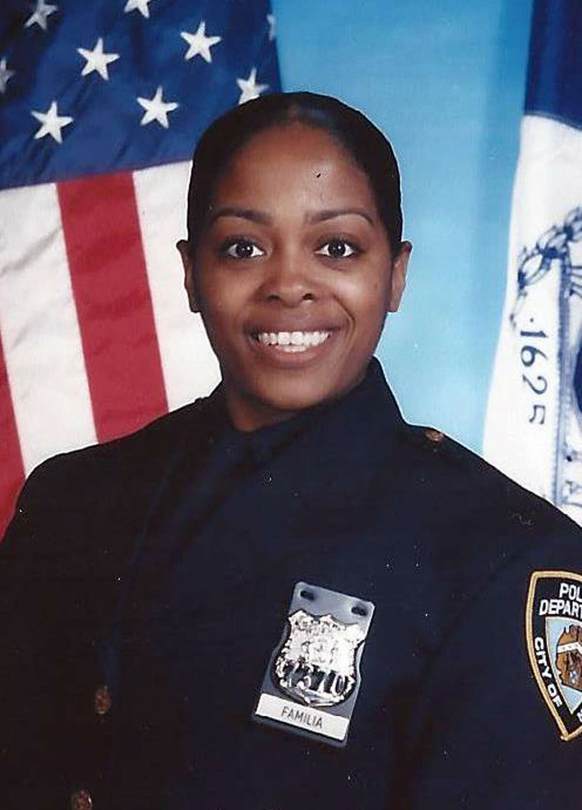 This undated photo provided by the New York Police Department shows officer Miosotis Familia, who was shot to death early Wednesday, July 5, 2017, ambushed inside a command post RV by an ex-convict, authorities said. The gunman was killed by police about a block away. (NYPD via AP)