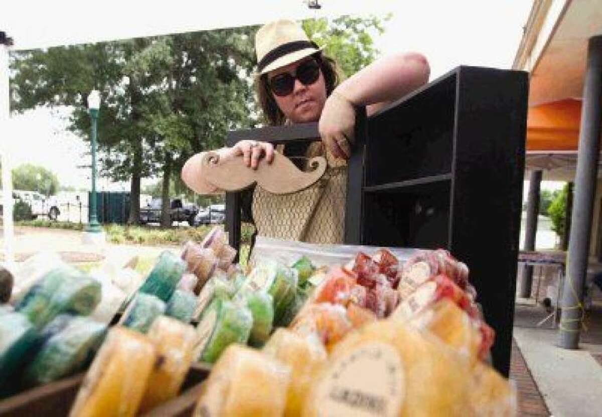 Heather Barricklow set up her soap selling shop before the Isaac Conroe Farmer's Market at Founder's Park in 2015. The farmers market will be held every first Thursday through October starting this week.