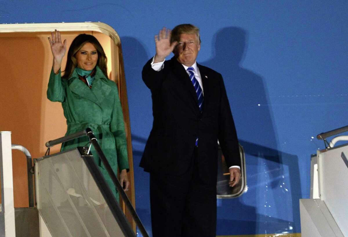 President Trump and the first lady Melania Trump wave from the Air Force One upon their arrival Warsaw, Poland, Wednesday, July 5, 2017. President Donald Trump is back to Europe hoping to receive a friendly welcome in Poland despite lingering skepticism across the continent over his commitment to NATO, his past praise of Russian President Vladimir Putin and his decision to pull the U.S. out of a major climate agreement. (AP Photo/Alik Keplicz)
