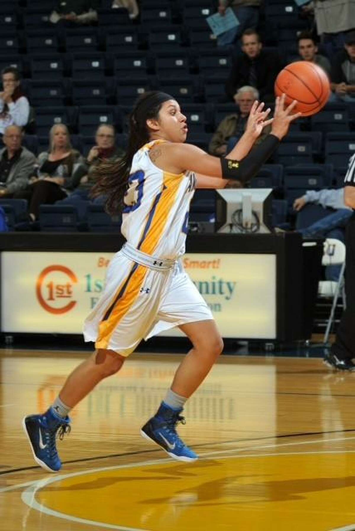 Former United South girls' basketball player Elaine Herrera played for five high school and college teams in six years, finishing off her senior year collegiately with an NCCAA Division II championship with Arlington Baptist in 2015-16.